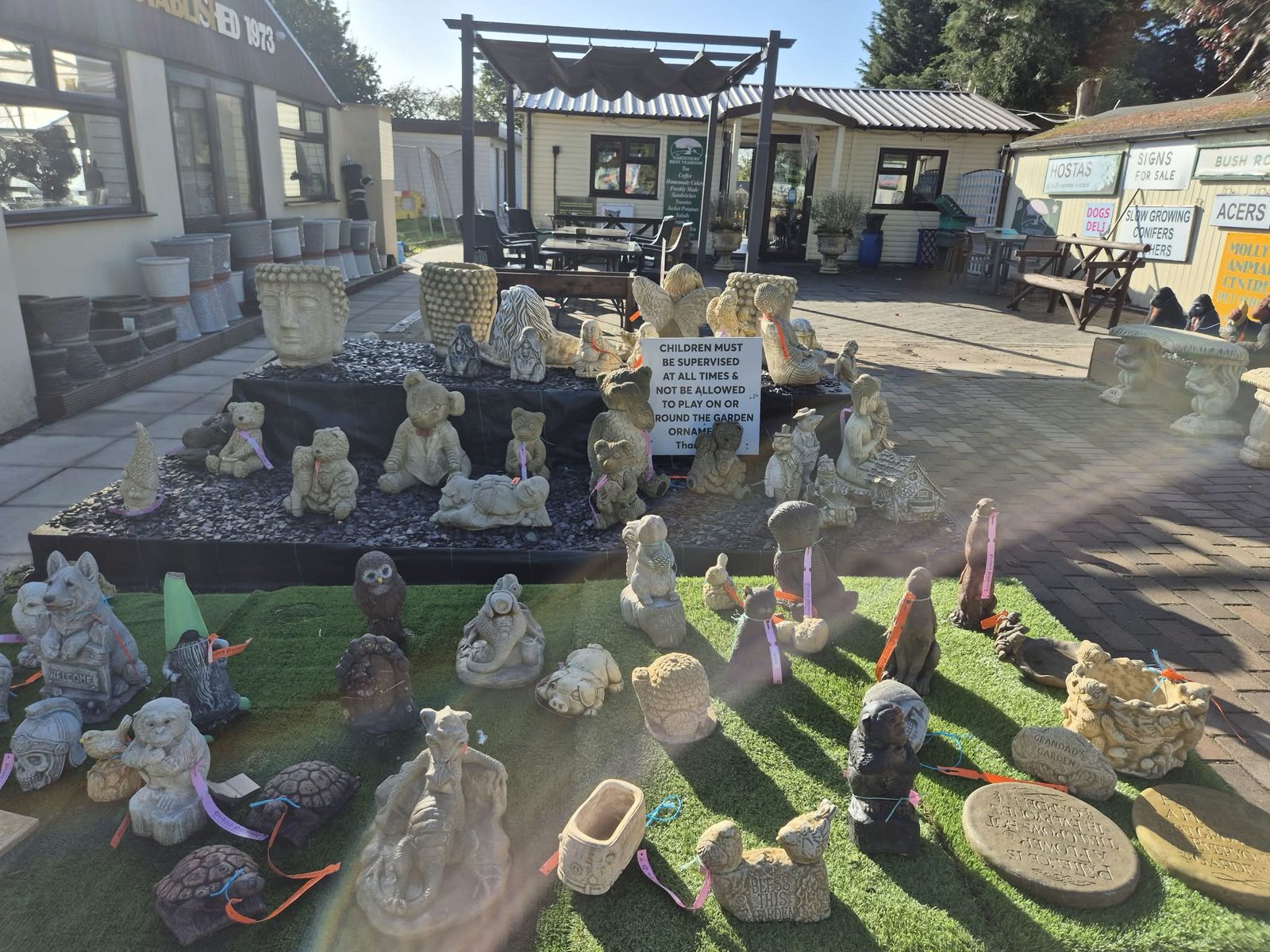 Stoneware ornaments near the entrance at Orchard Nurseries